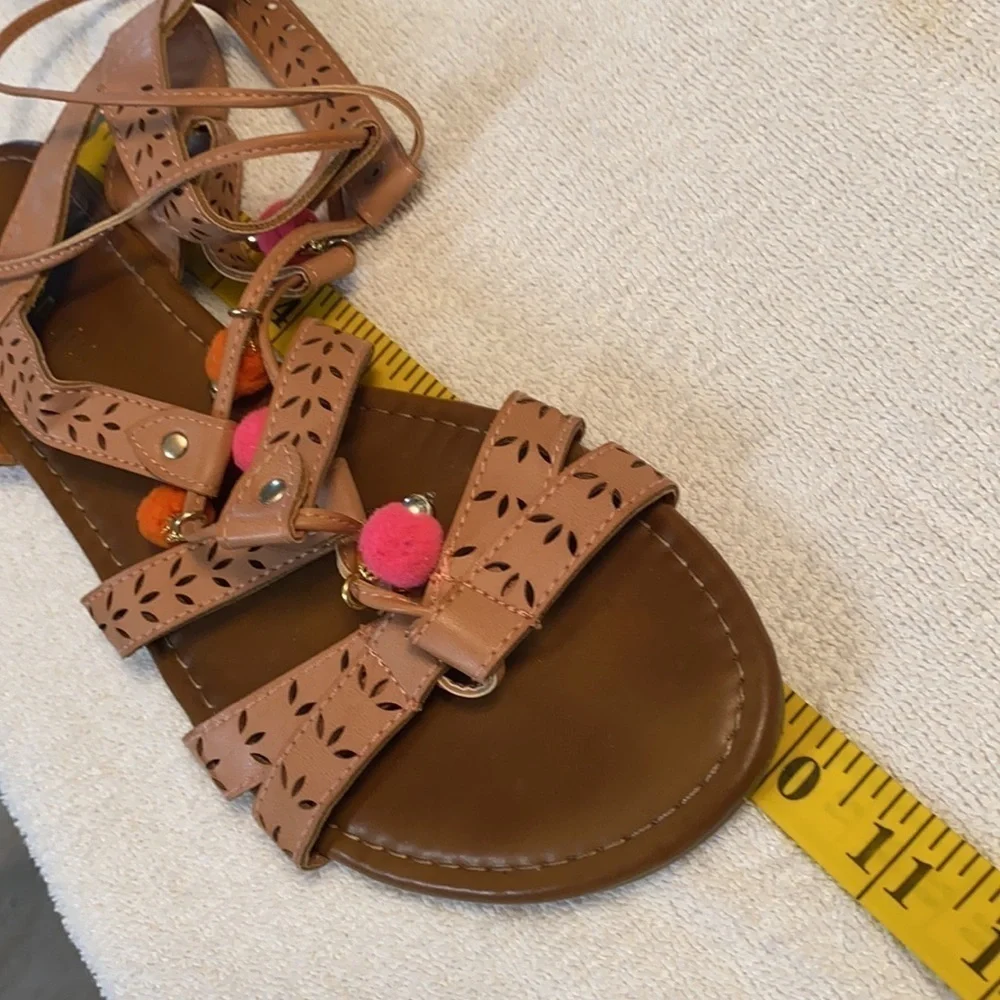 Madden Girl gladiator sandals laser cut decor lace up w/poms flats size 9